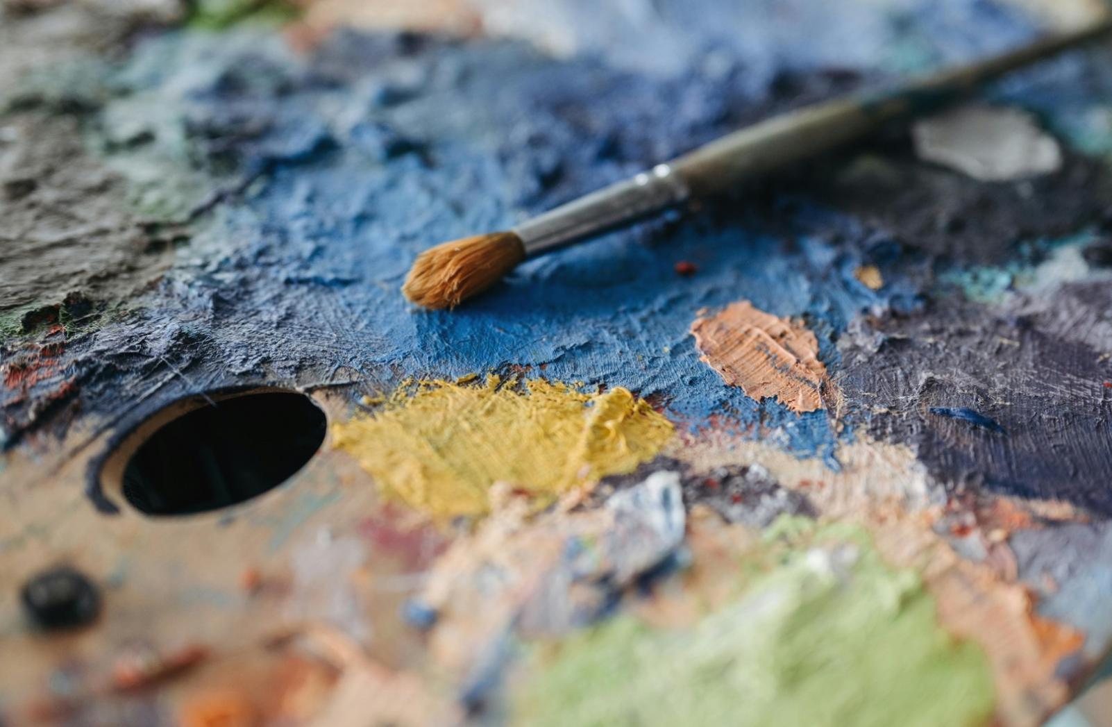 Student practicing observational drawing techniques in natural light