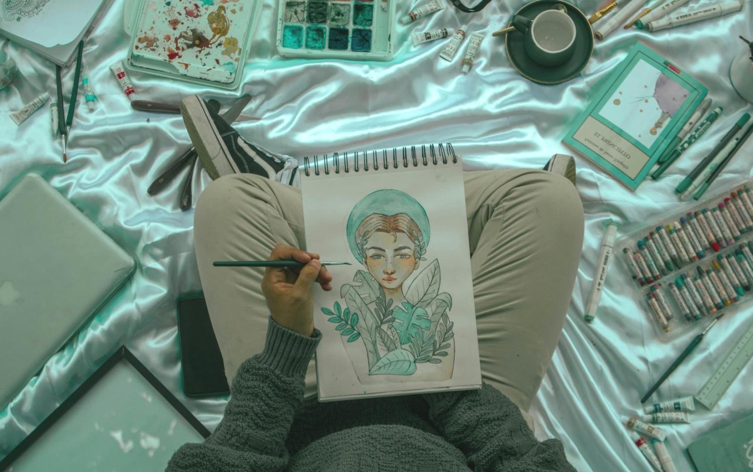 Drawing studio workspace with natural lighting and reference materials