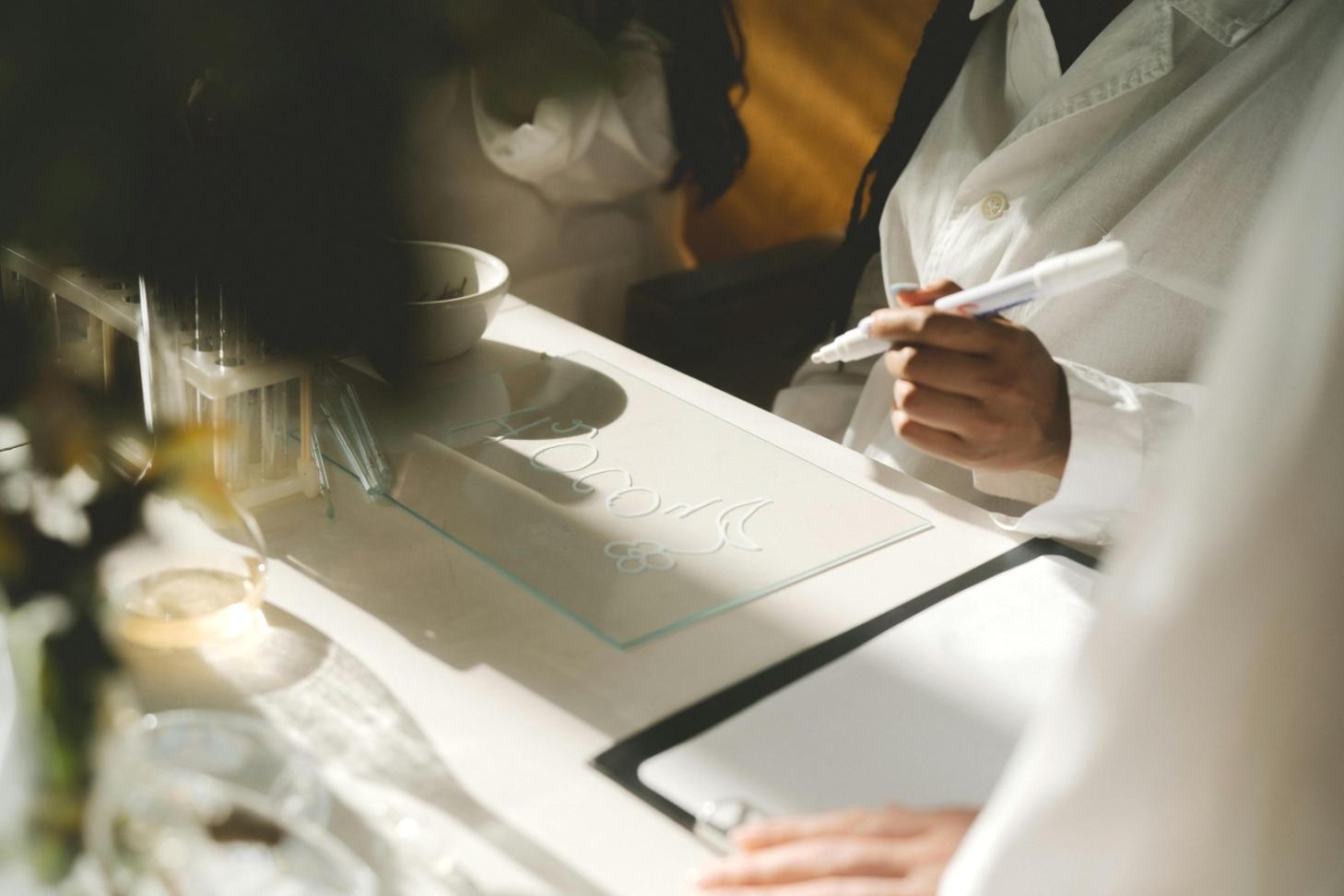 Student reviewing figure drawing techniques with instructor guidance